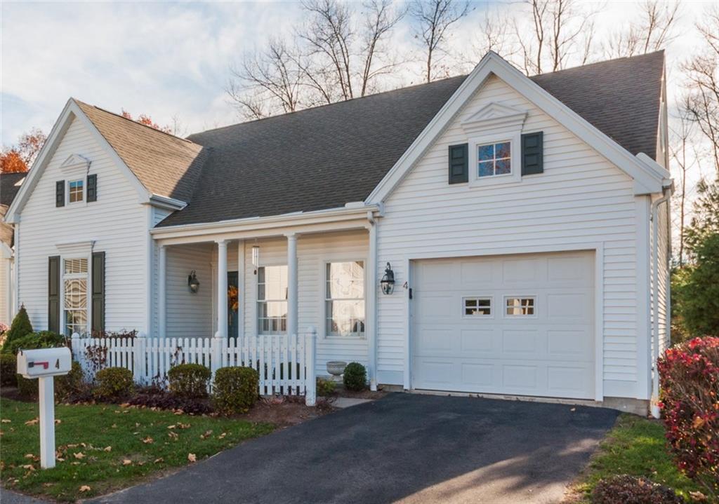 4 Nutmeg Road, Unit 4 Farmington, CT 06032 - Photo 1 of 1 a front view of a house with a yard
