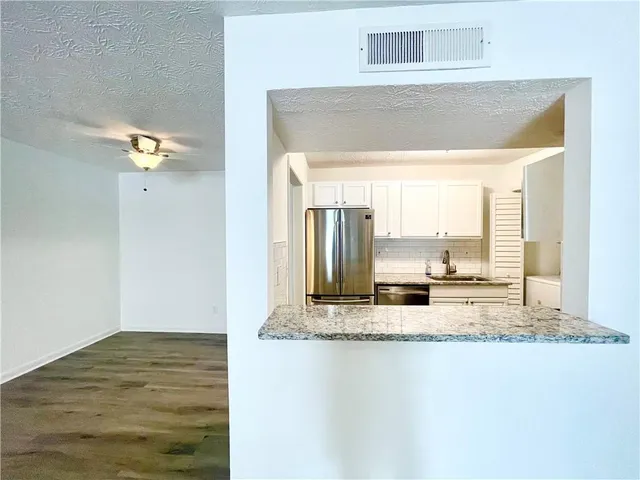 a view of kitchen and living room