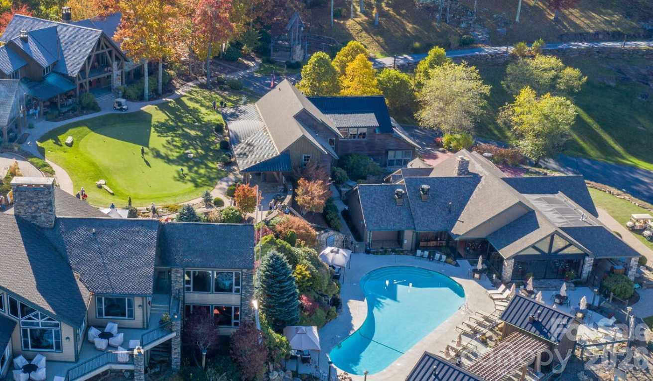 140 Slickrock Road, Unit F4 Burnsville, NC 28714 - Photo 37 of 41 an aerial view of a house with a swimming pool