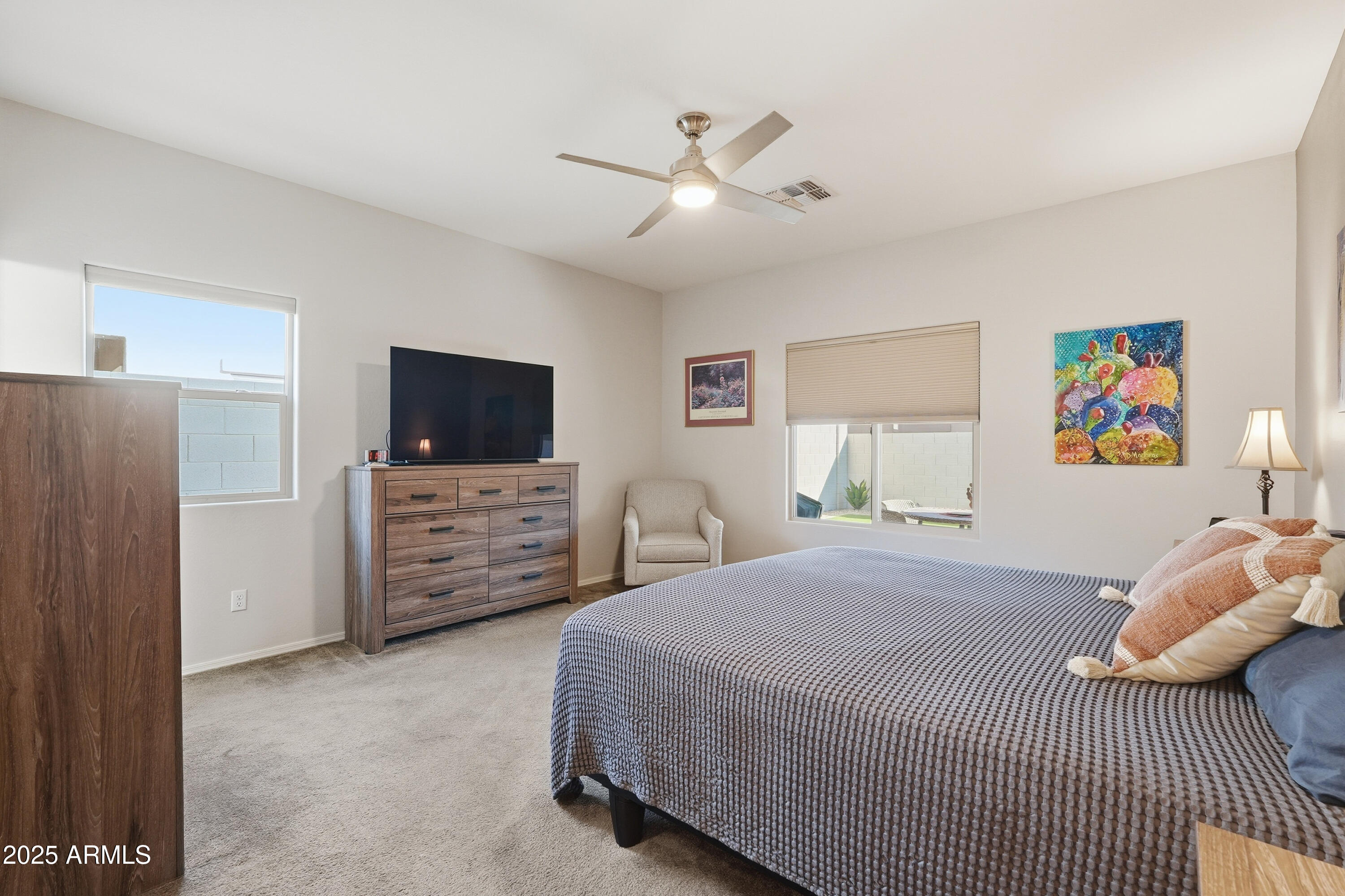 1815 South Hayley Road Apache Junction, AZ 85119 - Photo 17 of 33 a bedroom with furniture and a flat screen tv