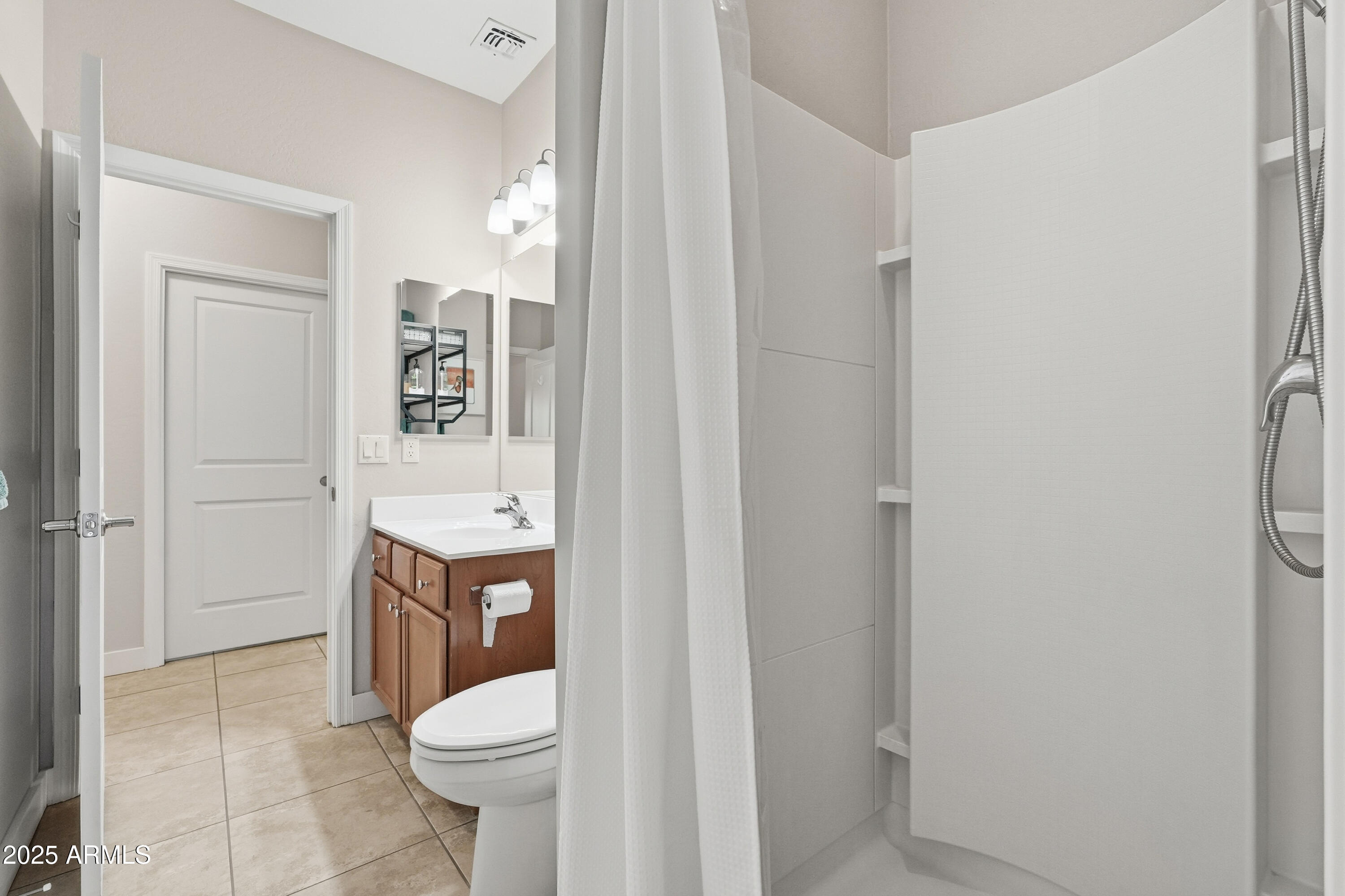 1815 South Hayley Road Apache Junction, AZ 85119 - Photo 20 of 33 a bathroom with a sink toilet and shower