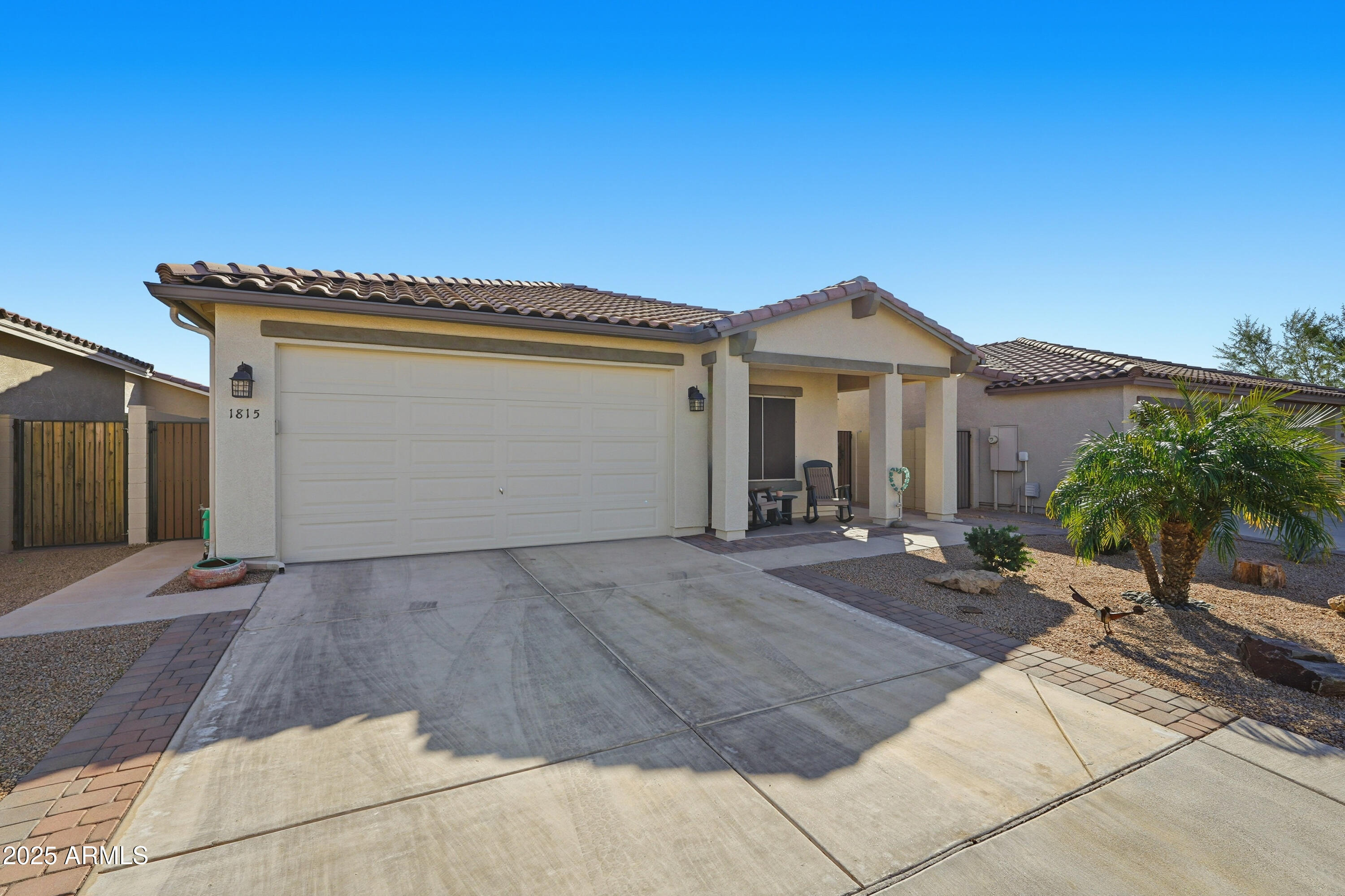 1815 South Hayley Road Apache Junction, AZ 85119 - Photo 2 of 33 a front view of a house with yard