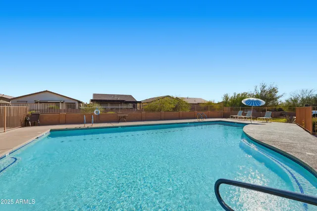 a view of swimming pool with a yard