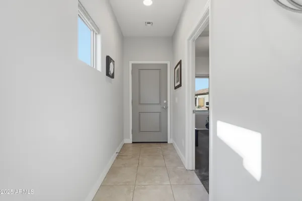 a view of a hallway with outdoor seating