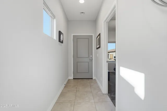a view of a hallway with outdoor seating