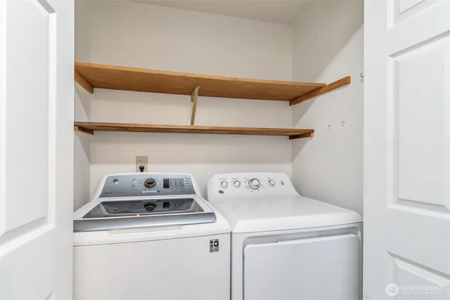 a utility room with dryer and washer