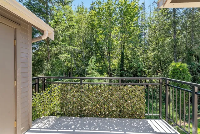a balcony with trees in front of it