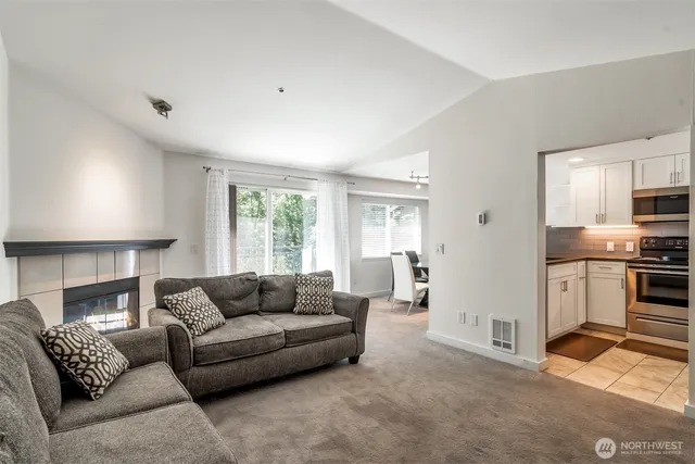 a living room with furniture and a large window