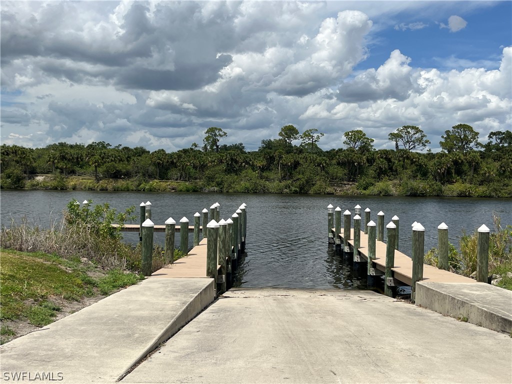 22776 Yellow Button Lane Alva, FL 33920 - Photo 4 of 7 a view of a lake from a yard