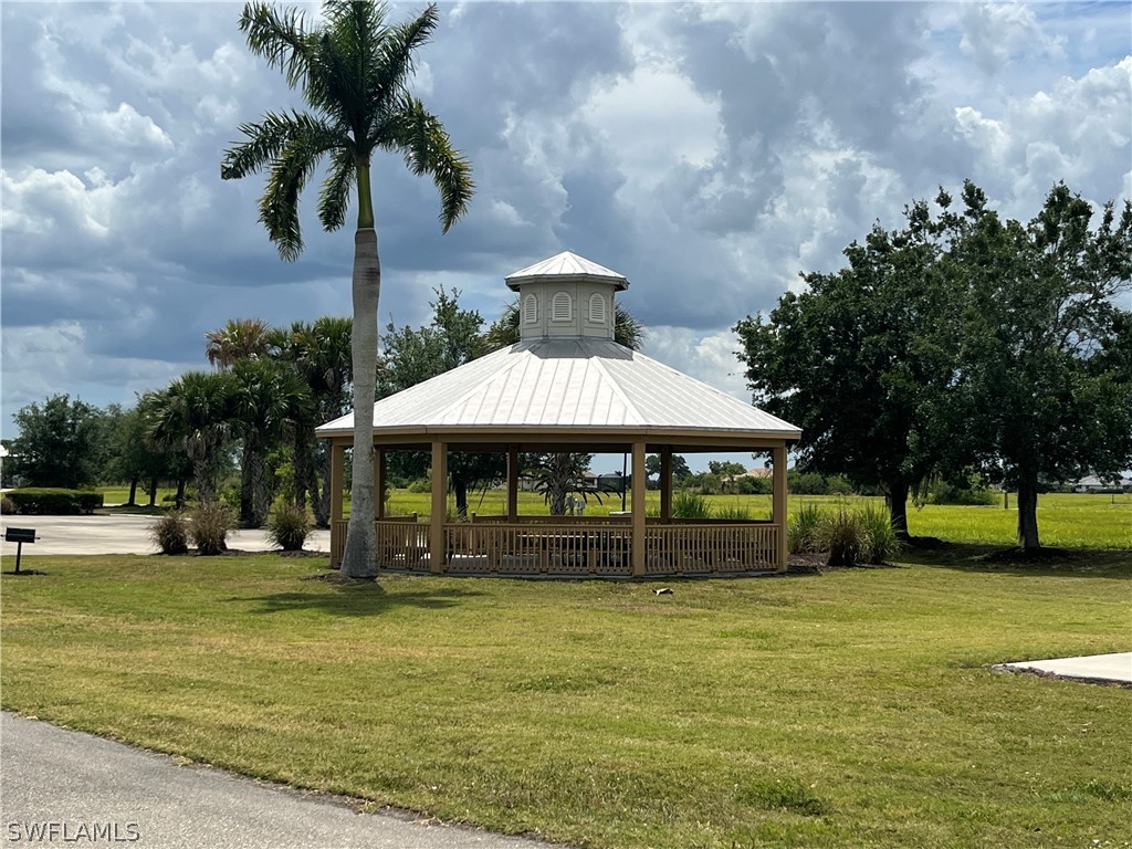 22776 Yellow Button Lane Alva, FL 33920 - Photo 6 of 7 a front view of a house with garden