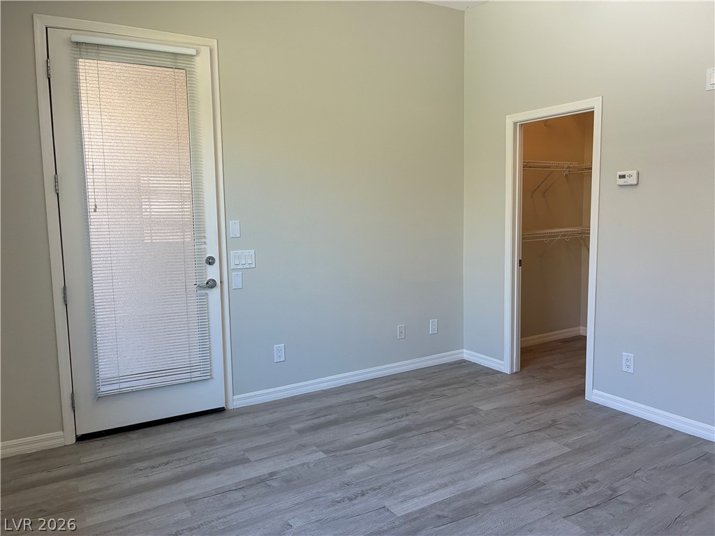 10 Caprington Road Henderson, NV 89052 - Photo 37 of 44 Laminate flooring extends into the walk-in closet, offering abundant storage.