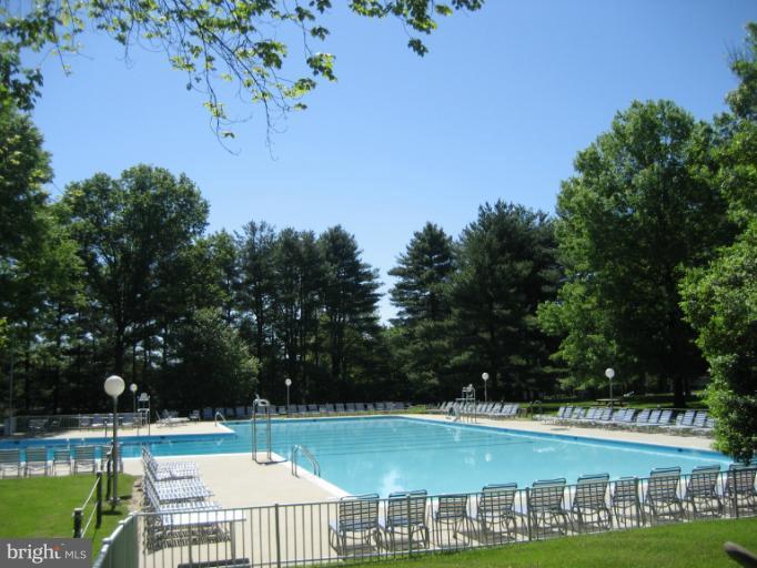3240 Birchtree Lane Silver Spring, MD 20906 - Photo 12 of 19 a view of a swimming pool with an outdoor space and seating area