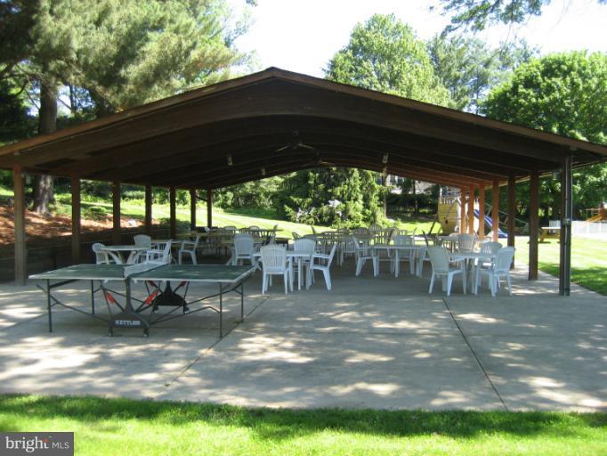 3240 Birchtree Lane Silver Spring, MD 20906 - Photo 14 of 19 a view of a patio with table and chairs under an umbrella