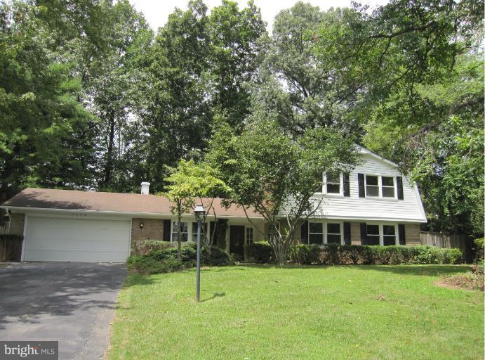3240 Birchtree Lane Silver Spring, MD 20906 - Photo 19 of 19 a front view of a house with a garden