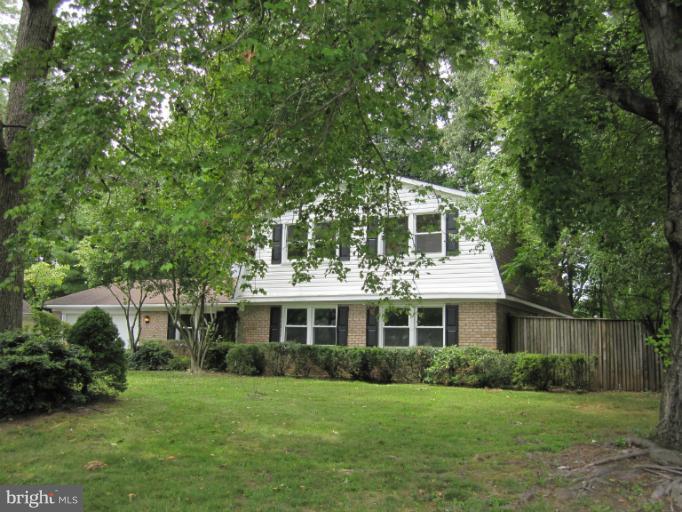 3240 Birchtree Lane Silver Spring, MD 20906 - Photo 3 of 19 a front view of a house with a garden