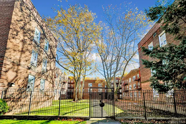 a view of a apartment with a yard
