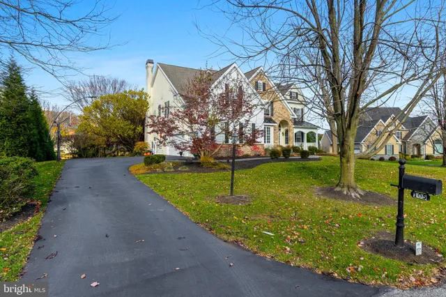 a living room with furniture and a piano
