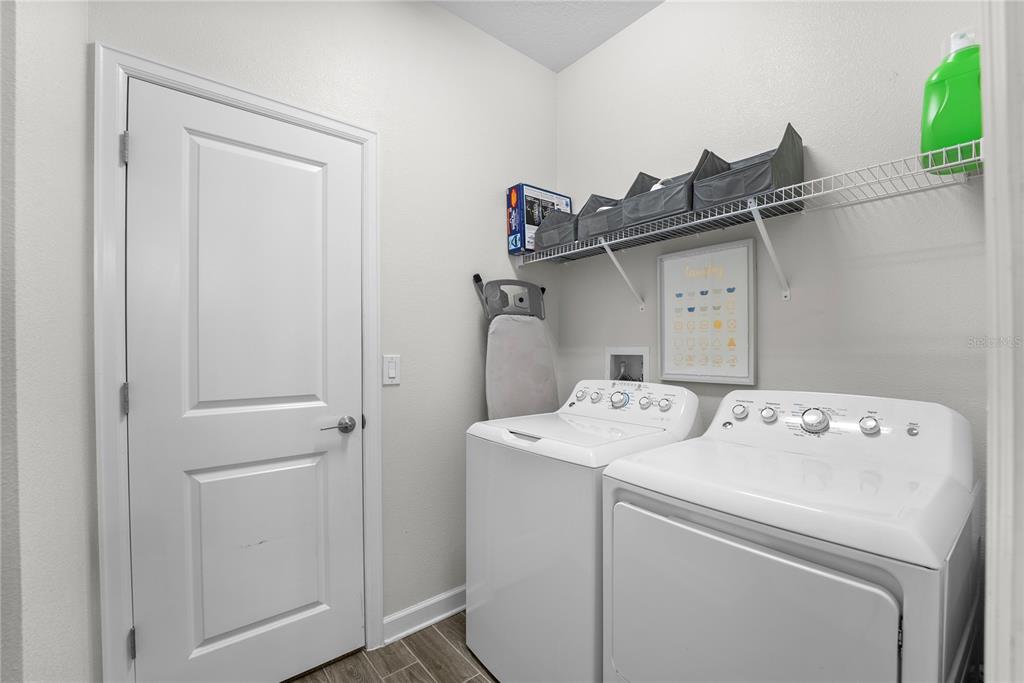 2926 Wordsmith Road Kissimmee, FL 34746 - Photo 25 of 42 a utility room with dryer and washer