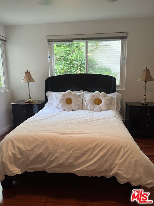 10655 Wilshire Boulevard, Unit 201 Los Angeles, CA 90024 - Photo 14 of 21 a bedroom with a bed and a large window