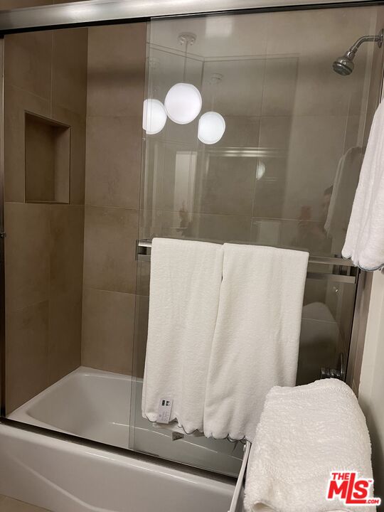 10655 Wilshire Boulevard, Unit 201 Los Angeles, CA 90024 - Photo 16 of 21 a bathroom with a sink and a mirror