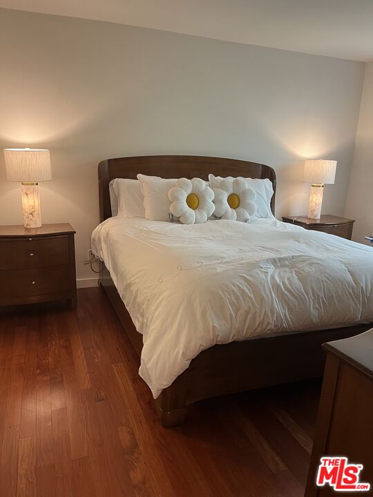 10655 Wilshire Boulevard, Unit 201 Los Angeles, CA 90024 - Photo 17 of 21 a bedroom with a bed and window