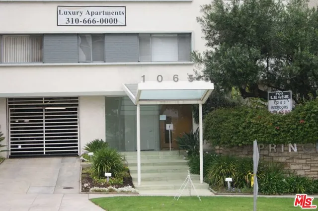 a front view of a building with garden