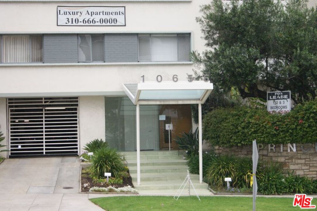 10655 Wilshire Boulevard, Unit 201 Los Angeles, CA 90024 - Photo 2 of 21 a front view of a building with garden
