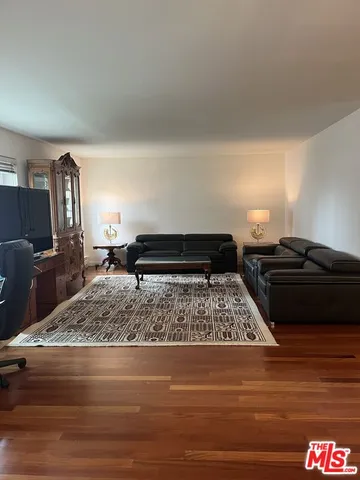 a living room with furniture and a rug