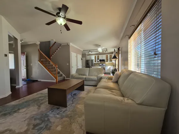 a living room with patio furniture and a window