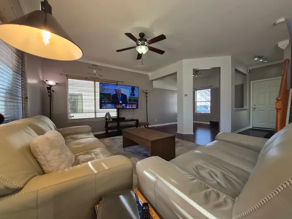 a living room with furniture and a large window
