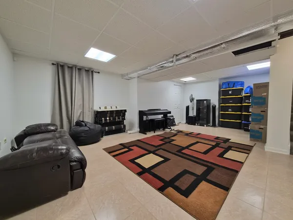 a room with furniture and a flat screen tv