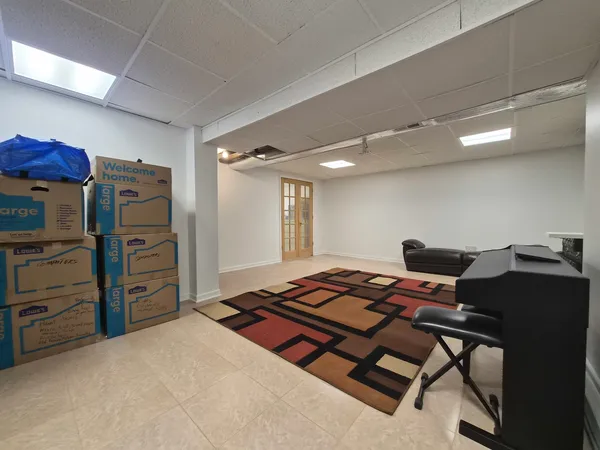 a bedroom with a bed and a chair