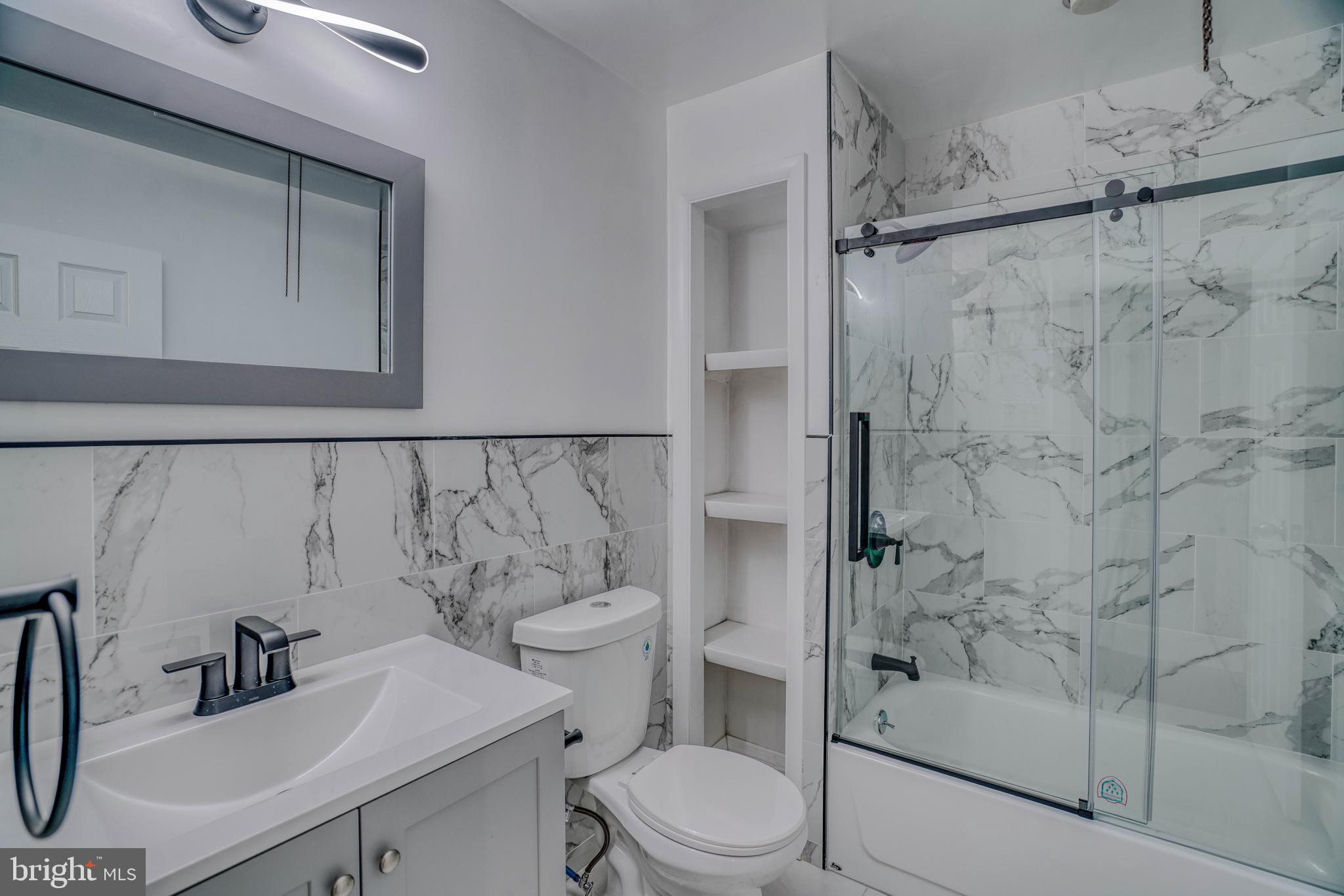2135 Granite Street Philadelphia, PA 19124 - Photo 1 of 34 a bathroom with a sink toilet and shower