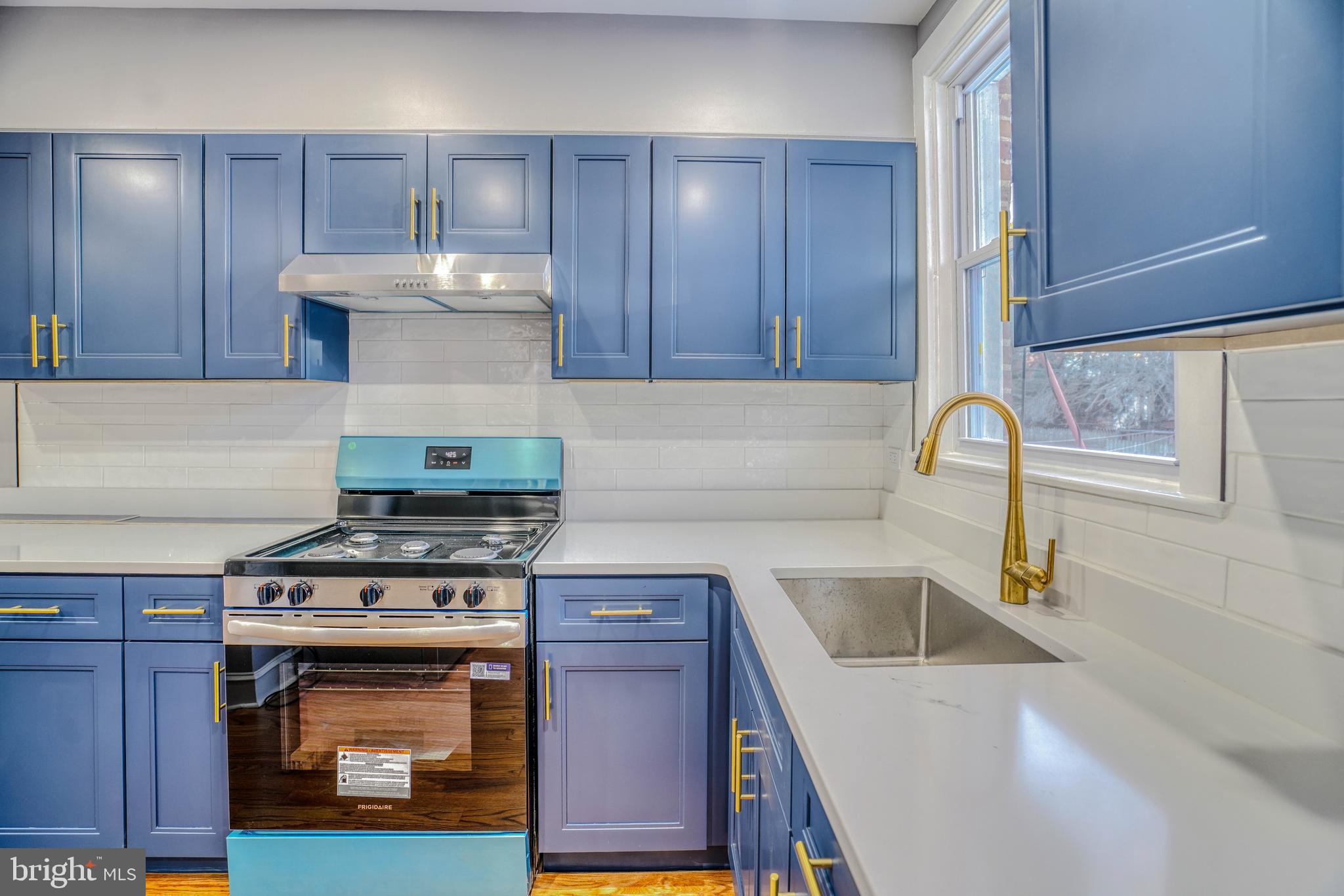 2135 Granite Street Philadelphia, PA 19124 - Photo 12 of 34 a kitchen with a stove and a sink