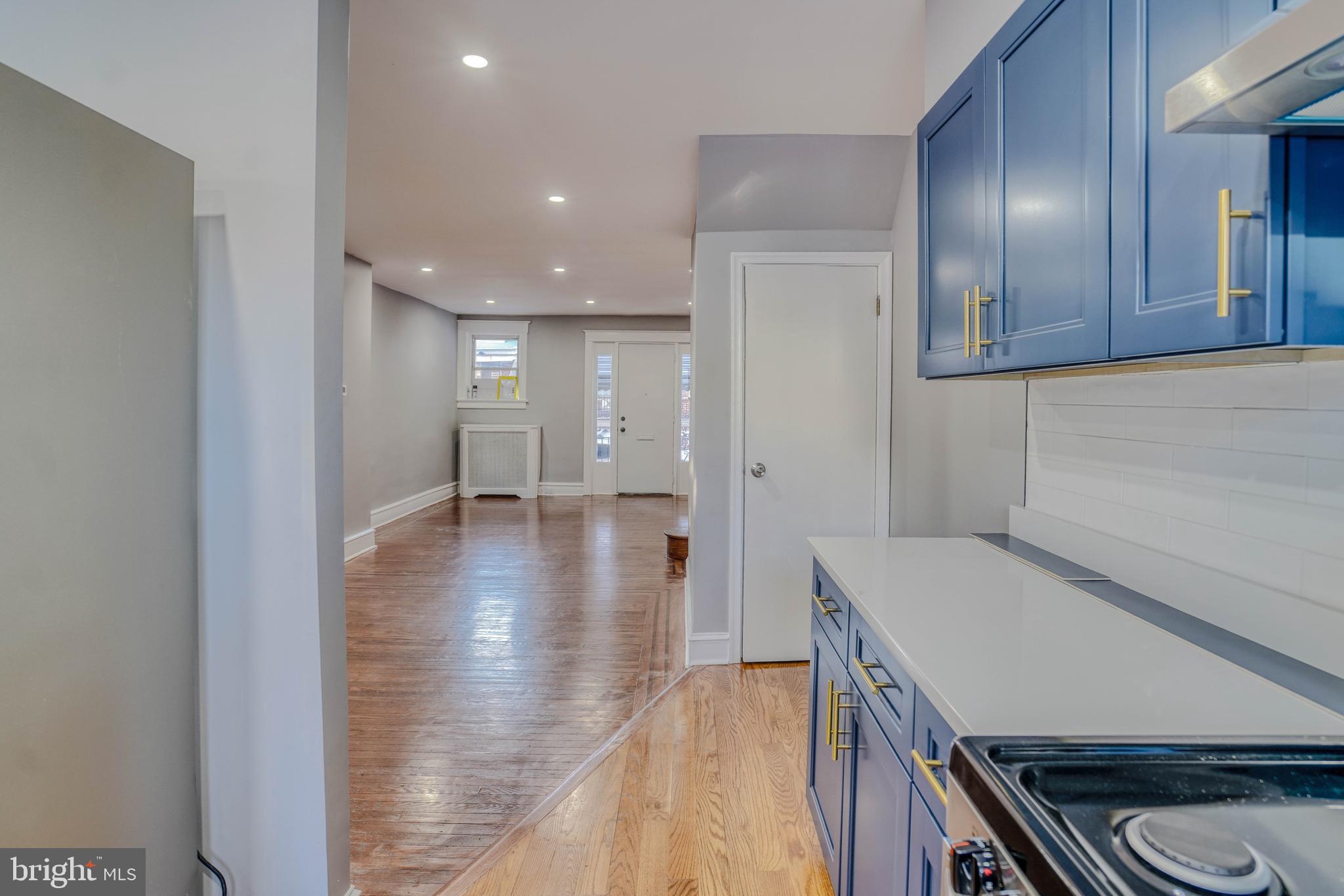 2135 Granite Street Philadelphia, PA 19124 - Photo 14 of 34 a view of a hallway with wooden floor and a sink