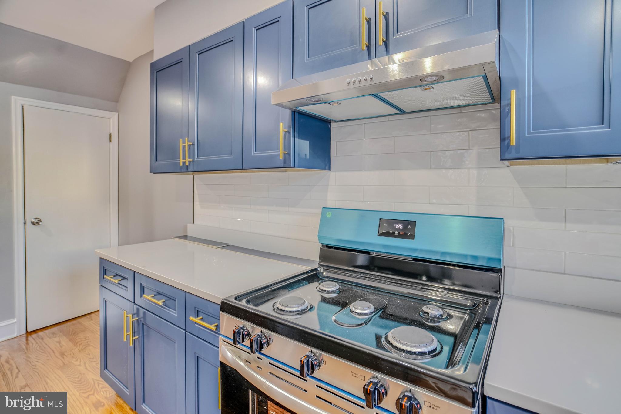 2135 Granite Street Philadelphia, PA 19124 - Photo 15 of 34 a stove top oven sitting inside of a kitchen