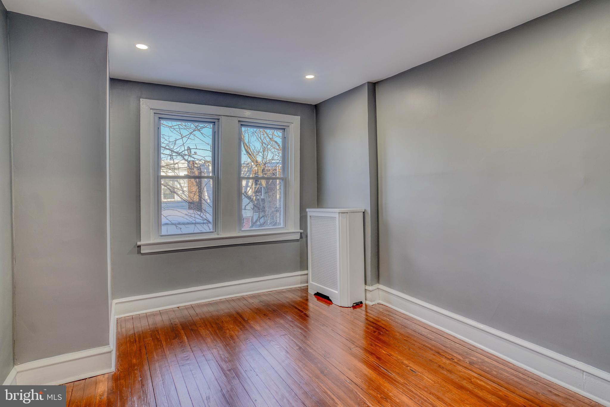 2135 Granite Street Philadelphia, PA 19124 - Photo 17 of 34 a view of empty room with wooden floor and fan