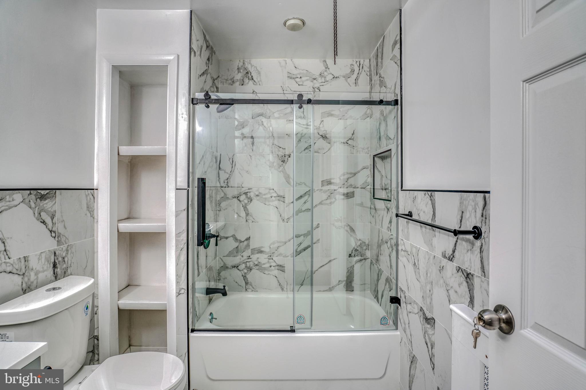 2135 Granite Street Philadelphia, PA 19124 - Photo 25 of 34 a bathroom with a toilet and a shower