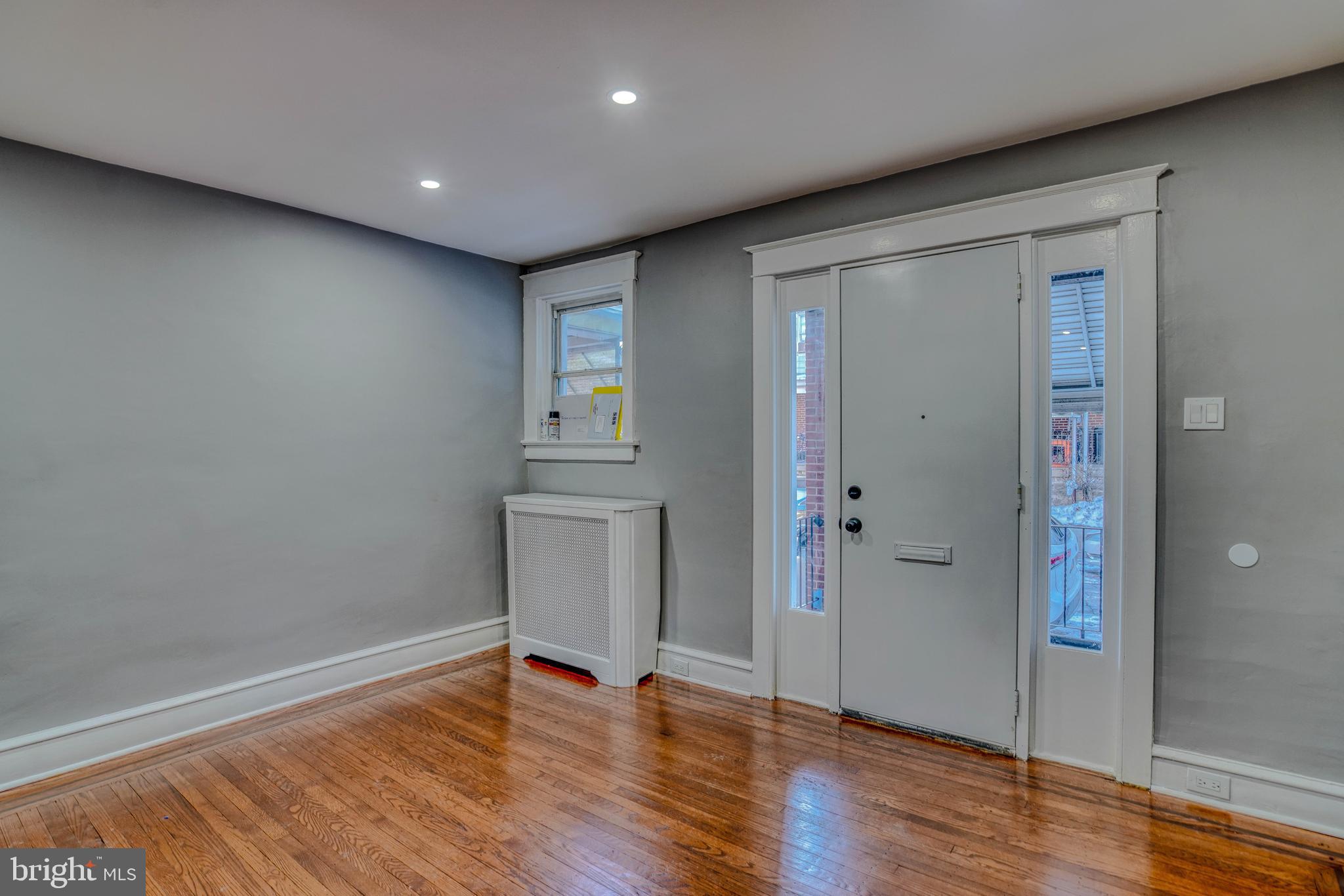 2135 Granite Street Philadelphia, PA 19124 - Photo 8 of 34 an empty room with wooden floor and a window