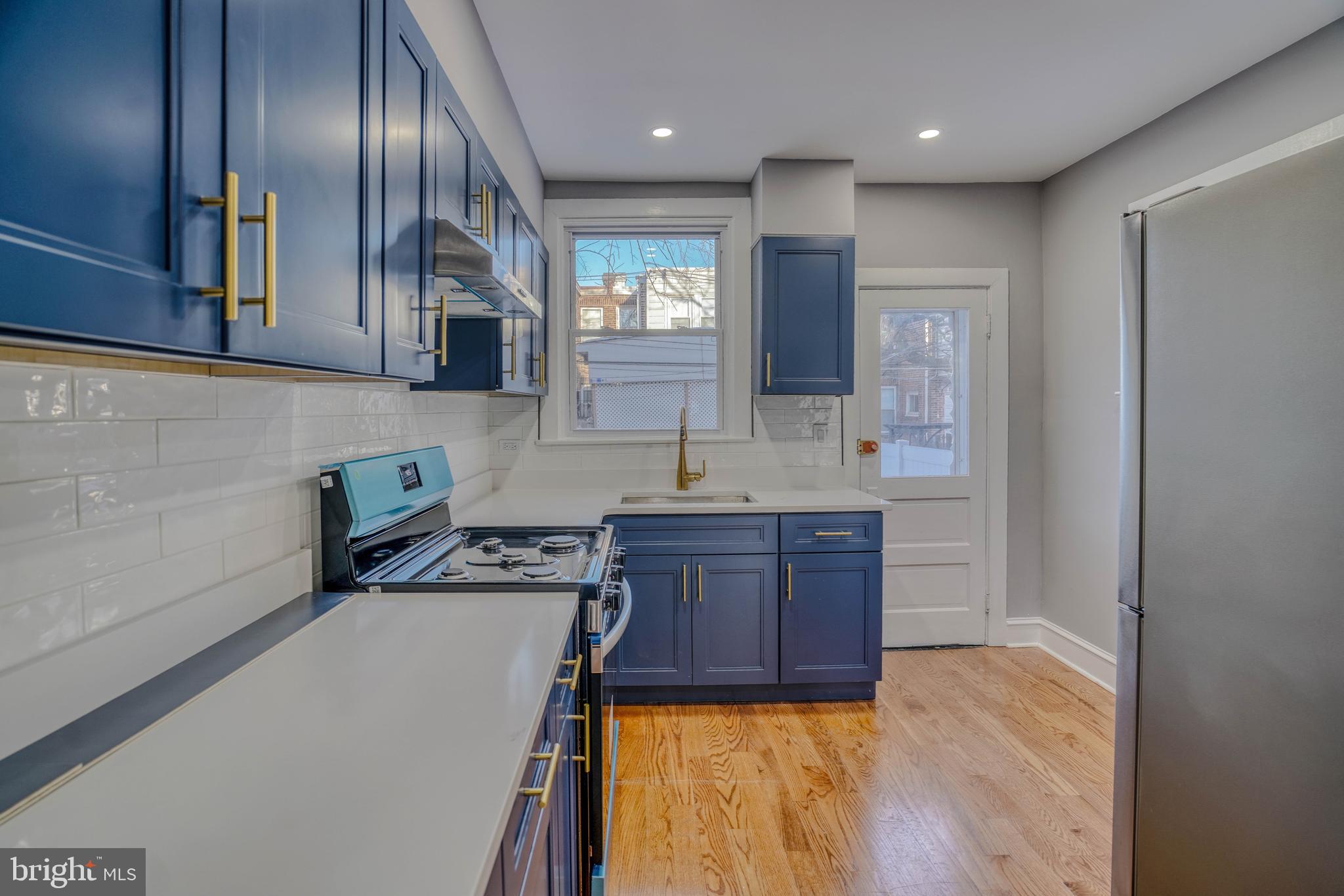 2135 Granite Street Philadelphia, PA 19124 - Photo 10 of 34 a kitchen with stainless steel appliances granite countertop a sink a stove and a refrigerator