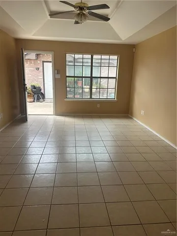 a view of an empty room and a window