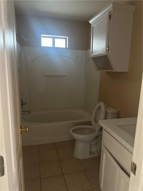 1213 Prosperity Drive, Unit D Edinburg, TX 78541 - Photo 3 of 10 a bathroom with a toilet and a mirror