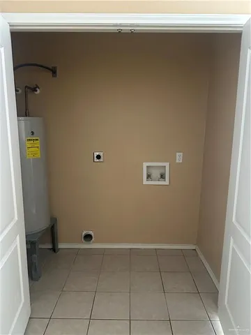 a kitchen with cabinets and white appliances