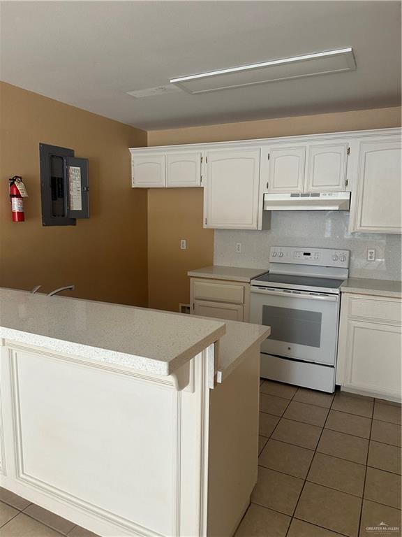 1213 Prosperity Drive, Unit D Edinburg, TX 78541 - Photo 9 of 10 a kitchen with cabinets and white appliances