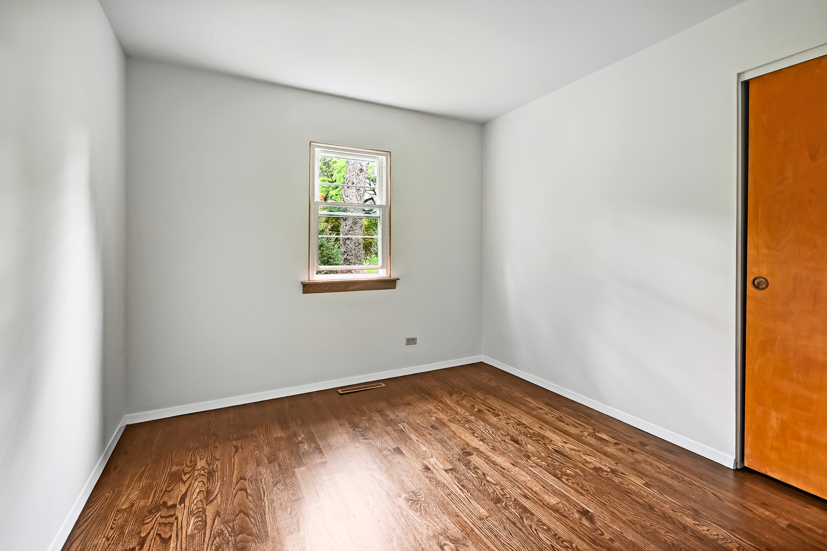 1018 Rolling Drive Lisle, IL 60532 - Photo 13 of 17 an empty room with wooden floor and windows