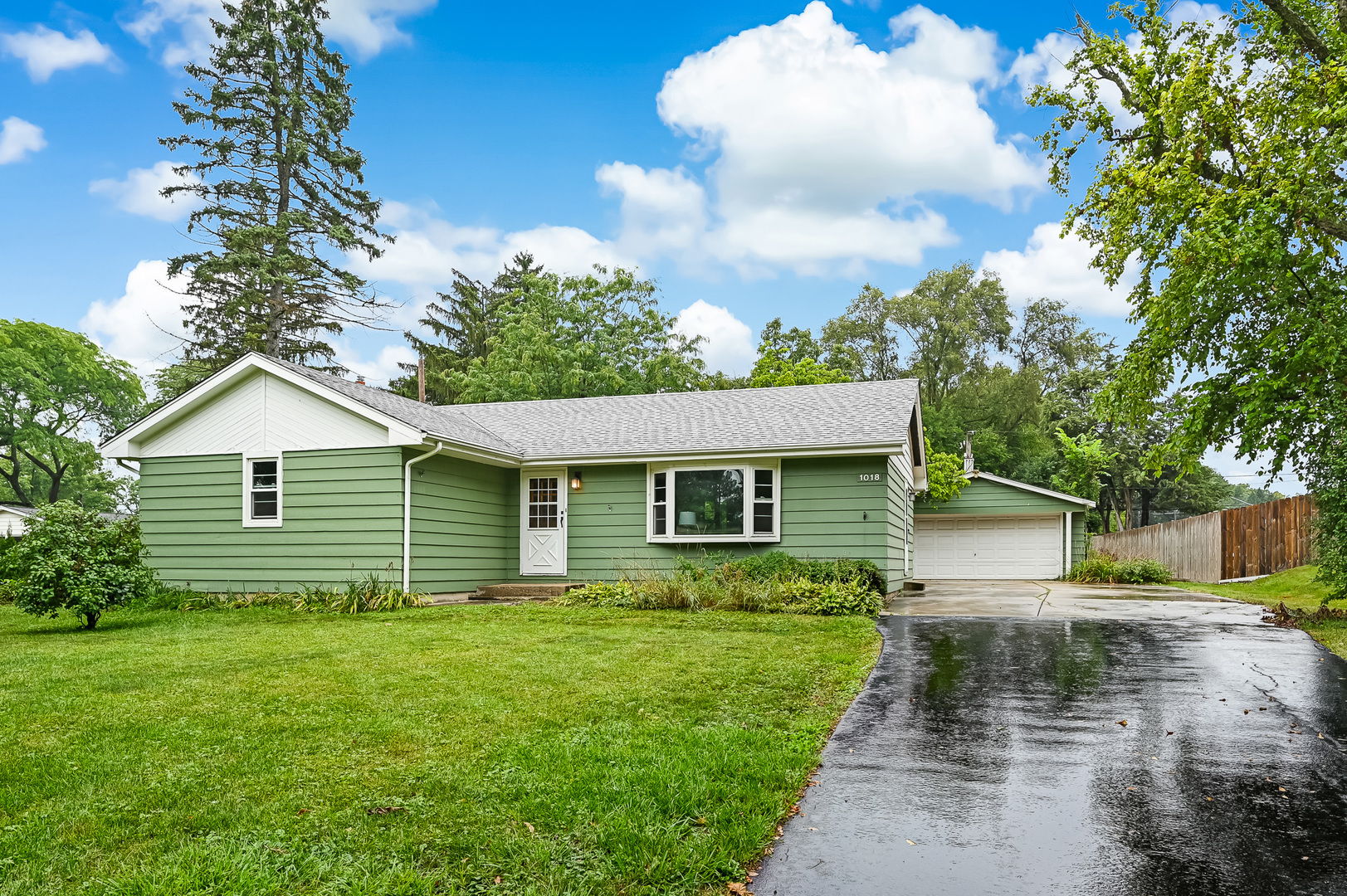 1018 Rolling Drive Lisle, IL 60532 - Photo 2 of 17 a front view of house with yard and green space