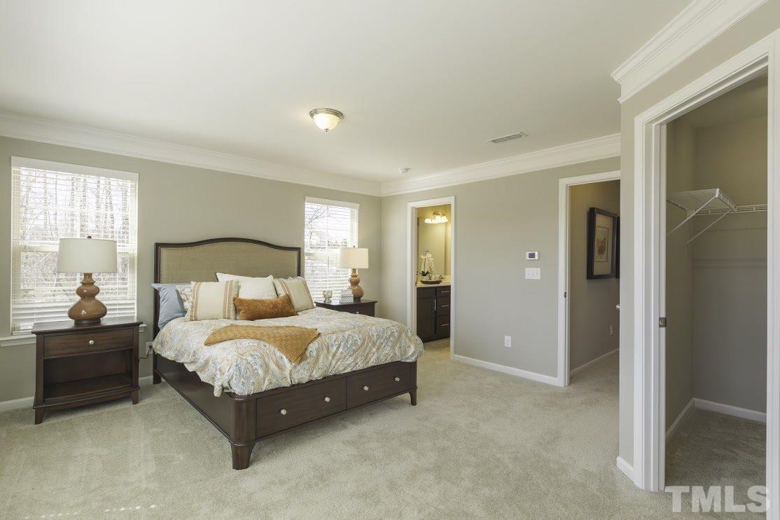 1420 Chatuga Way Raleigh, NC 27610 - Photo 13 of 13 a bedroom with a bed and window