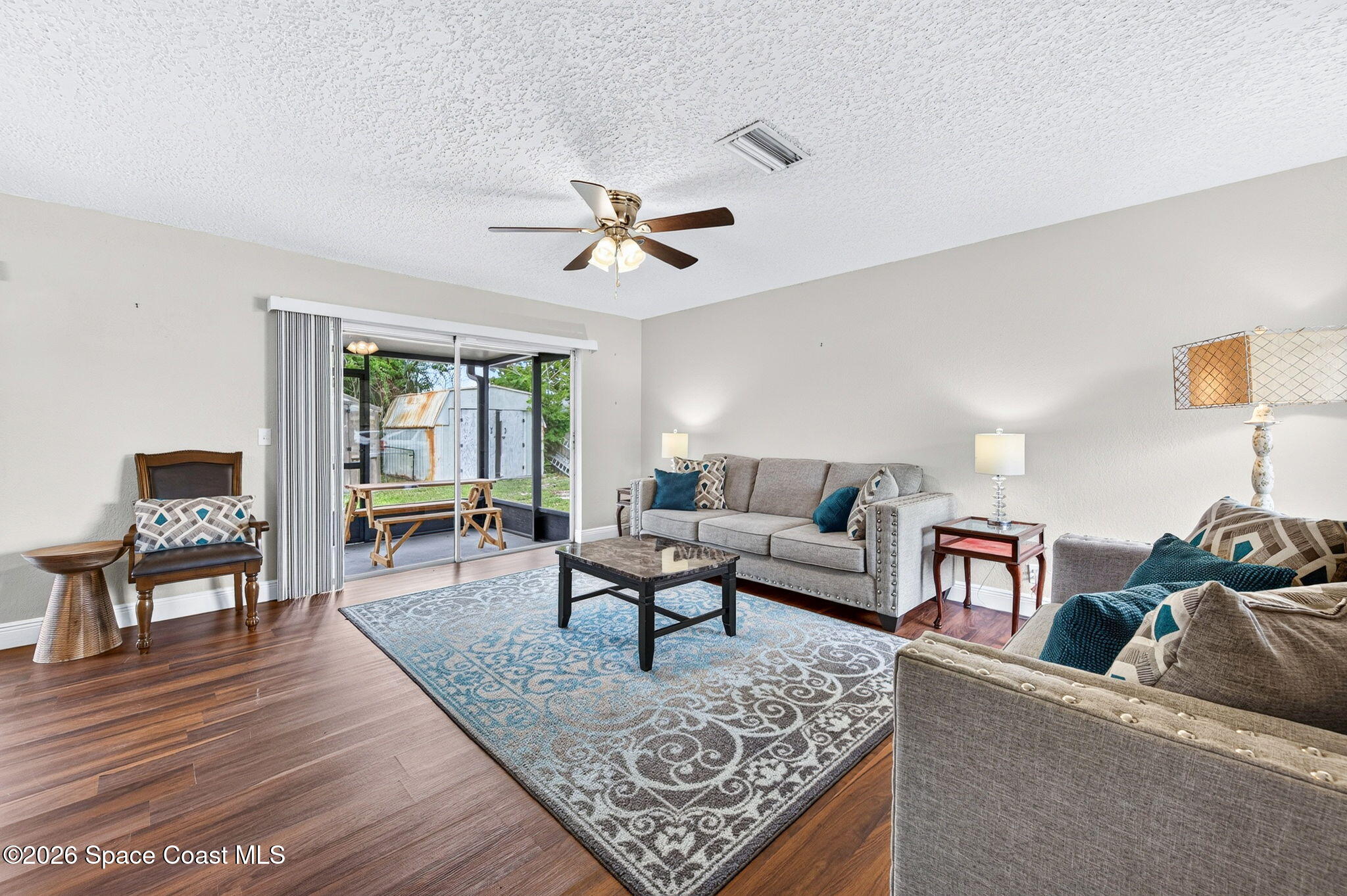 996 Botany Lane Rockledge, FL 32955 - Photo 6 of 35 a living room with furniture and a wooden floor