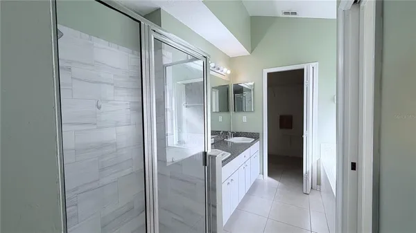 a view of a closet and a floor to ceiling window