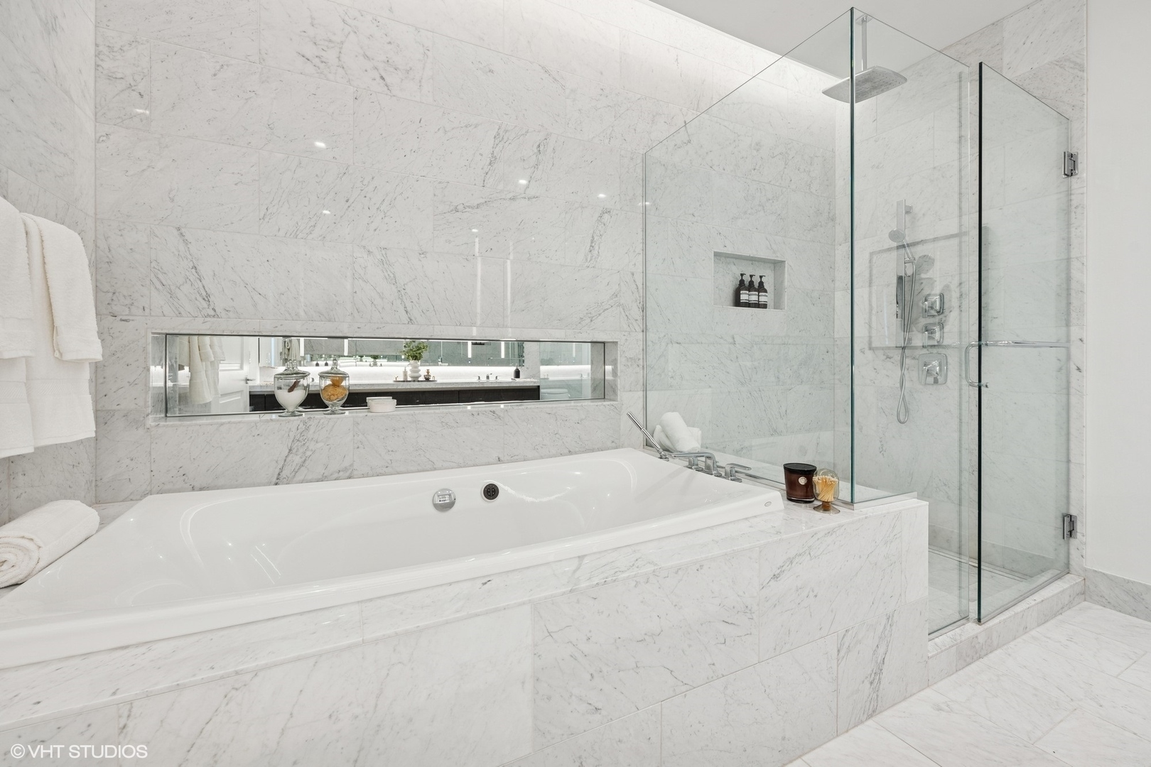 363 East Wacker Drive, Unit 1903 Chicago, IL 60601 - Photo 17 of 39 a bathroom with a bathtub and a shower